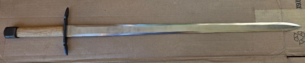 Hand and a half medieval sword, very sturdily built, dull edges, black sheath