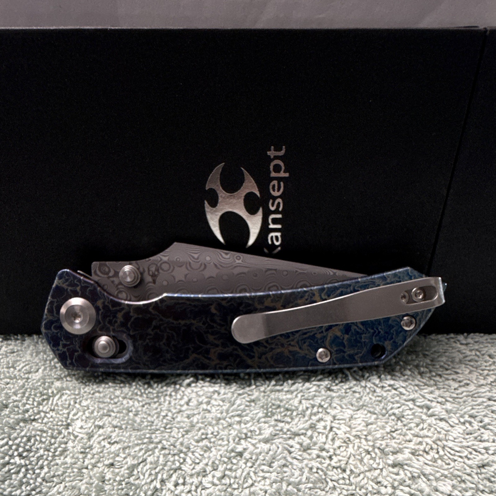 Kansept Fenrir | Damascus Steel Manual Drop Point Plain | Button Lock Ti Blue