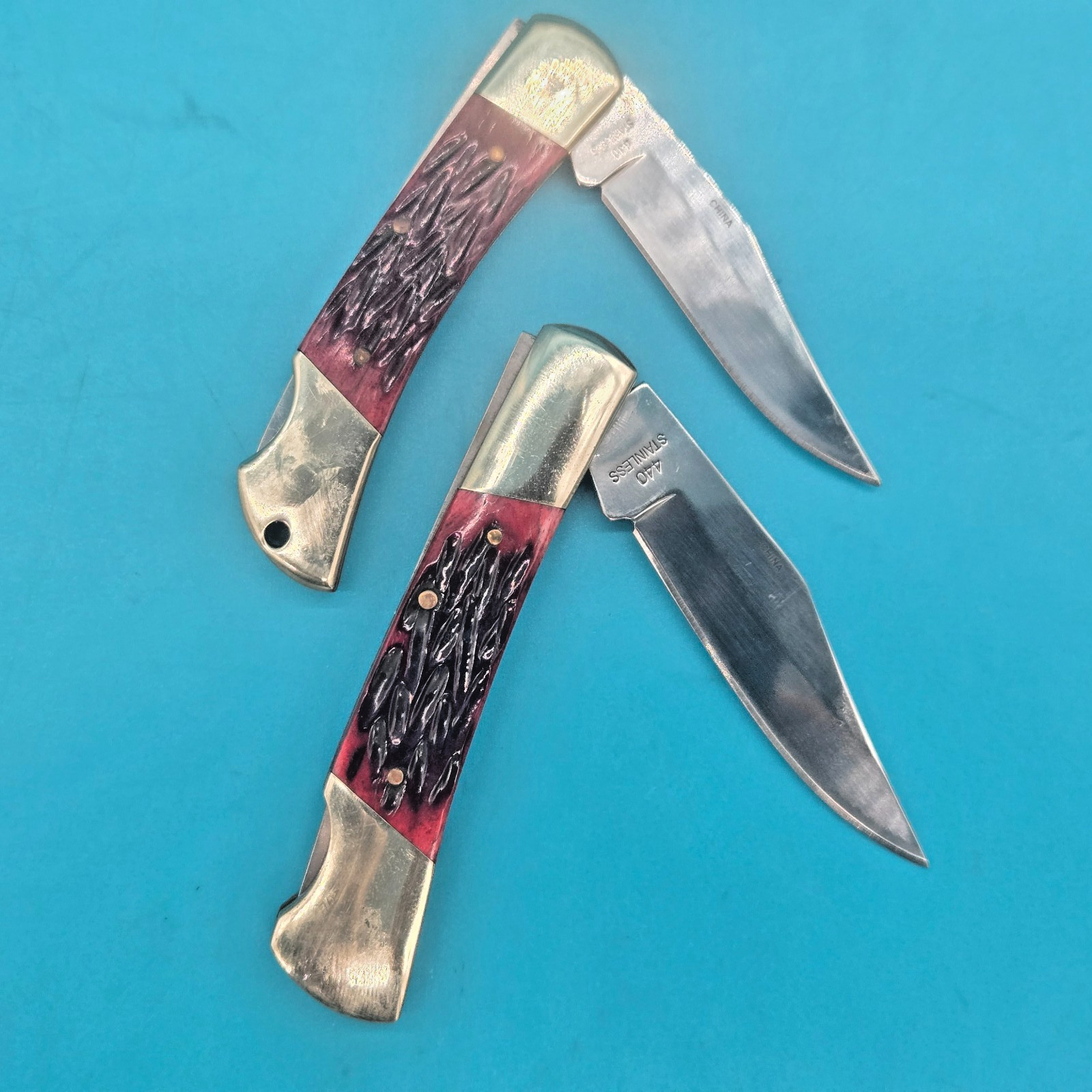 2 (TWO) STEEL WARRIOR BONE HANDLE LOCKBACK POCKET KNIVES. 3.5 «& 3» HANDLES.