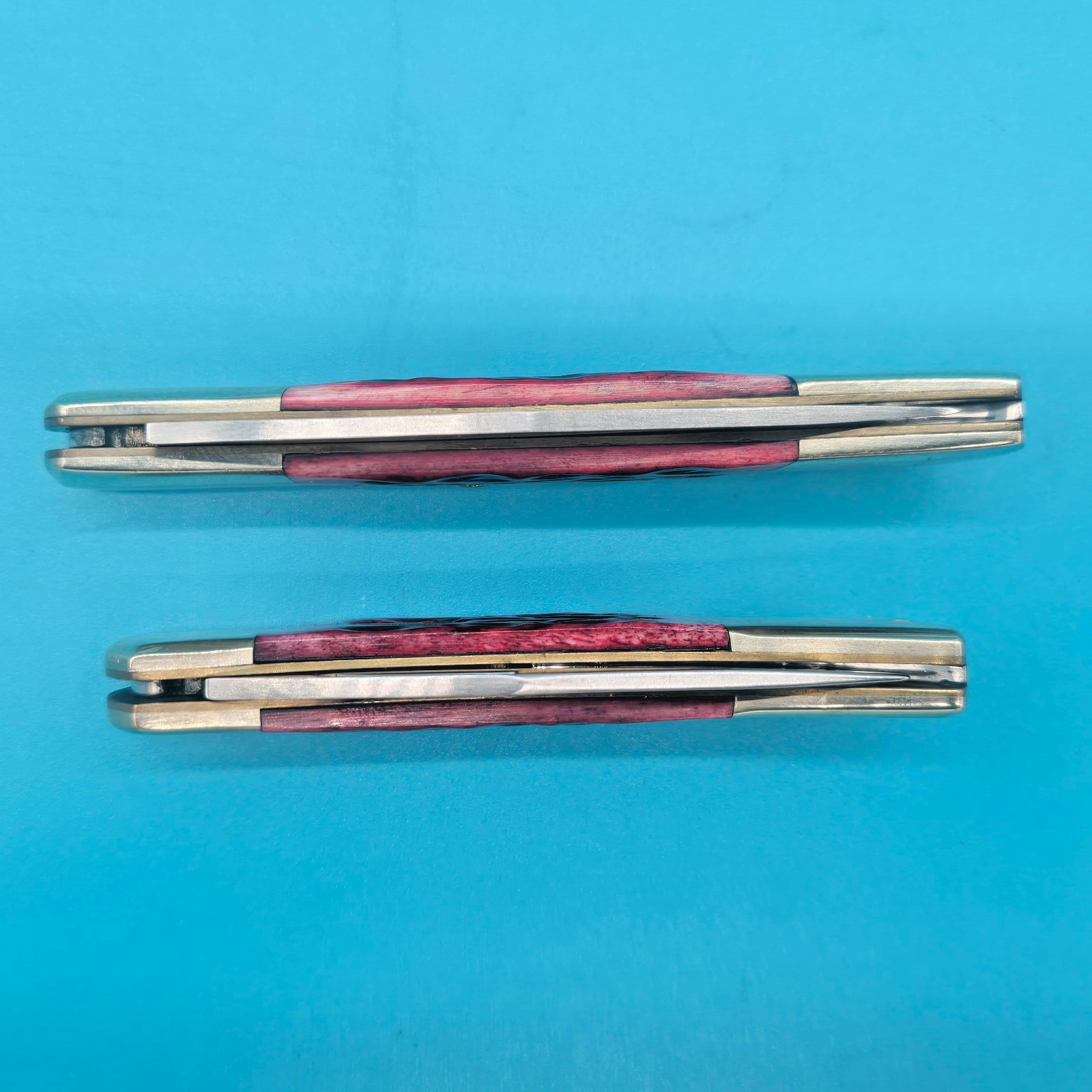 2 (TWO) STEEL WARRIOR BONE HANDLE LOCKBACK POCKET KNIVES. 3.5 «& 3» HANDLES.