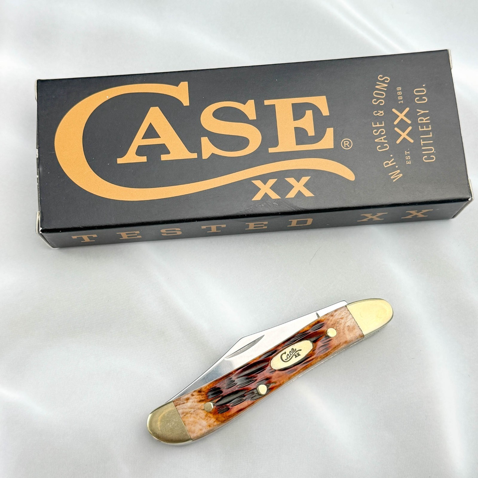 Case xx Knives 00045 Peach Seed Jig Amber Bone Peanut Stainless Pocket Knife
