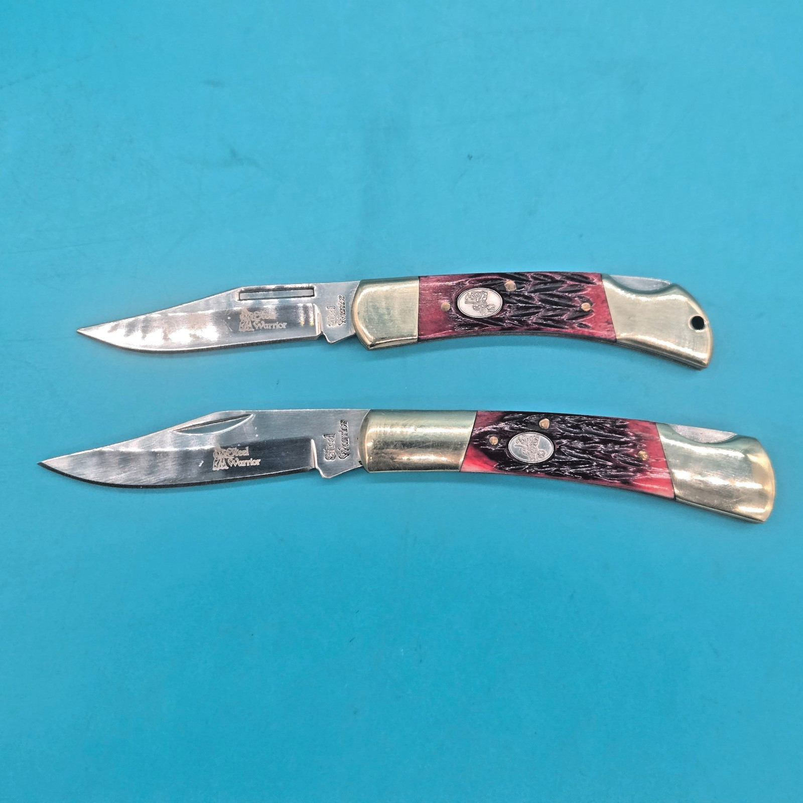 2 (TWO) STEEL WARRIOR BONE HANDLE LOCKBACK POCKET KNIVES. 3.5 «& 3» HANDLES.