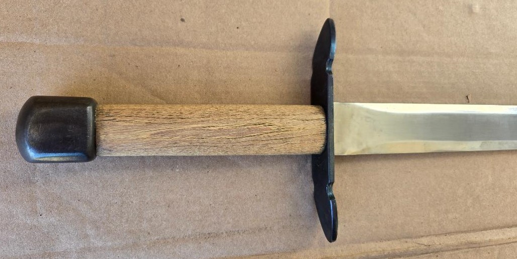 Hand and a half medieval sword, very sturdily built, dull edges, black sheath
