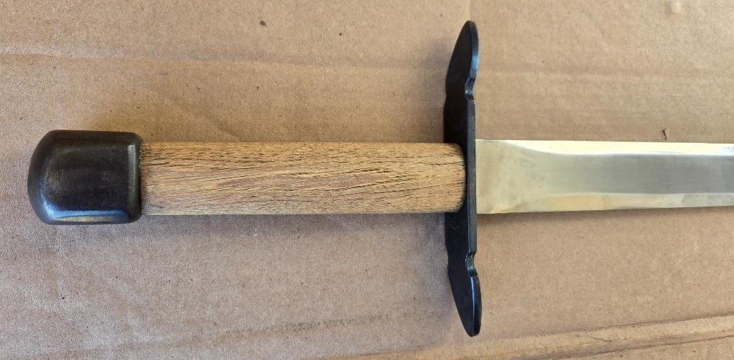 Hand and a half medieval sword, very sturdily built, dull edges, black sheath