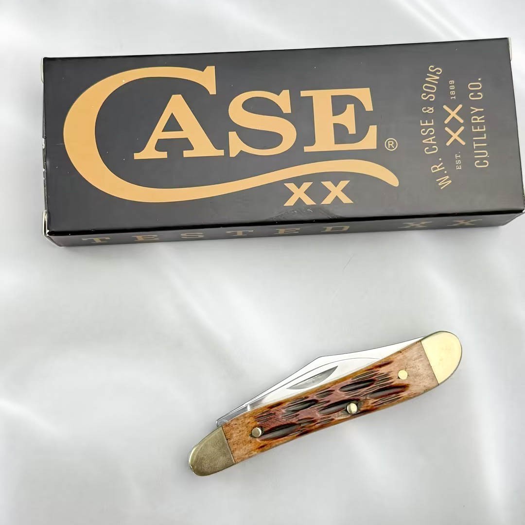Case xx Knives 00045 Peach Seed Jig Amber Bone Peanut Stainless Pocket Knife