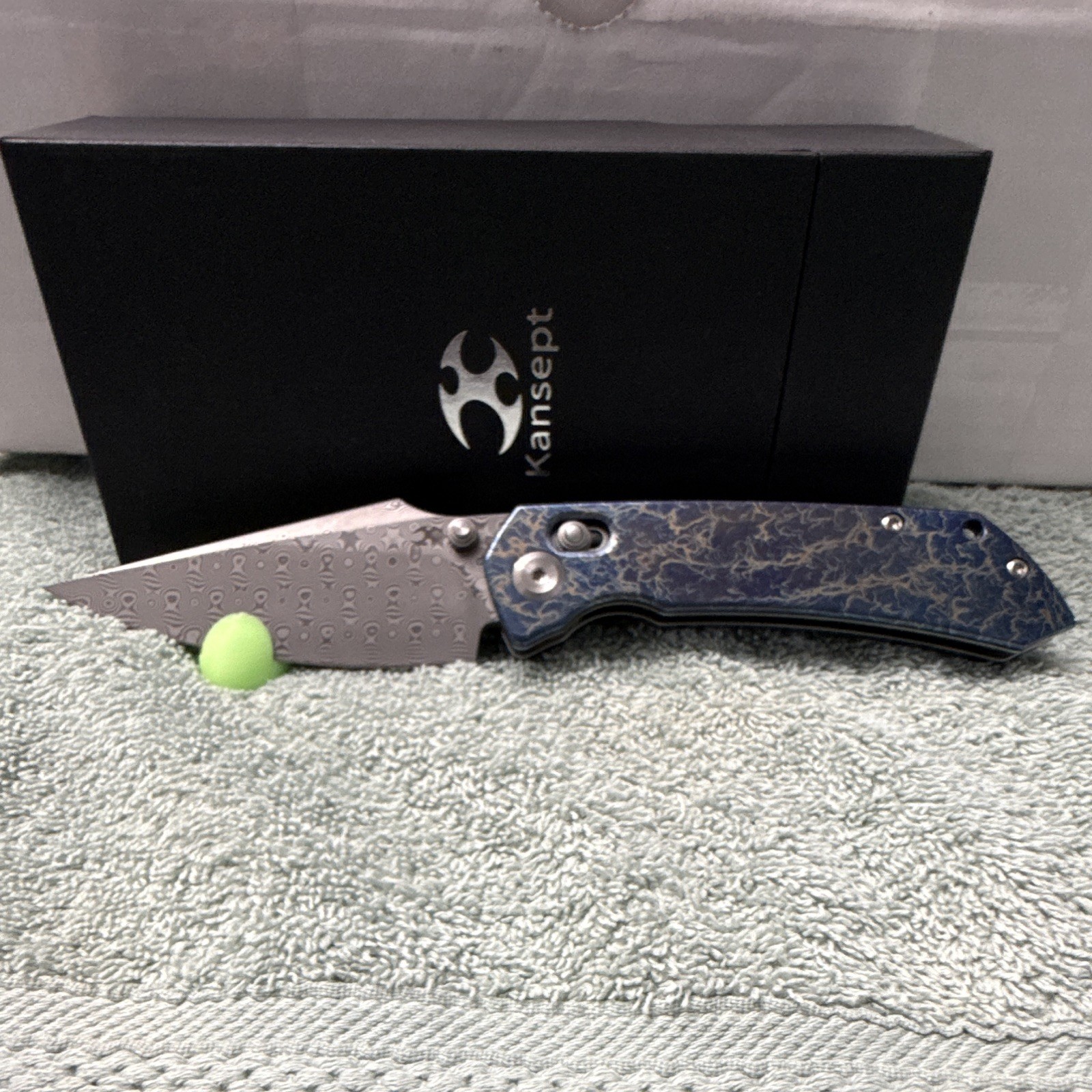 Kansept Fenrir | Damascus Steel Manual Drop Point Plain | Button Lock Ti Blue