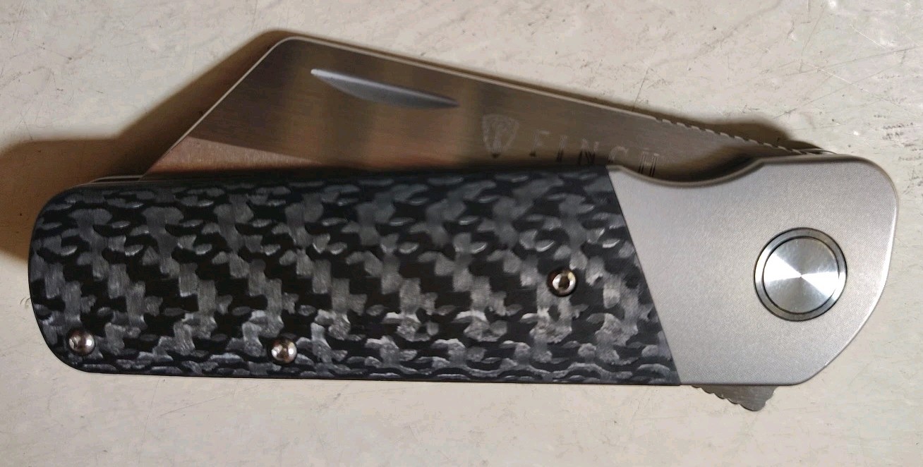 Finch Knife Co RUNTLY XL Dark Side Flipper 3.15″ M390 Wharnie Ti w/CF Handle