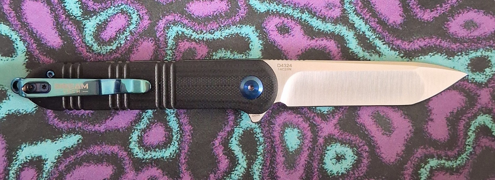 Dreamtech K4324GB Pivot Button Lock Black G10 Blue Accents 14C28N Pocket Knife