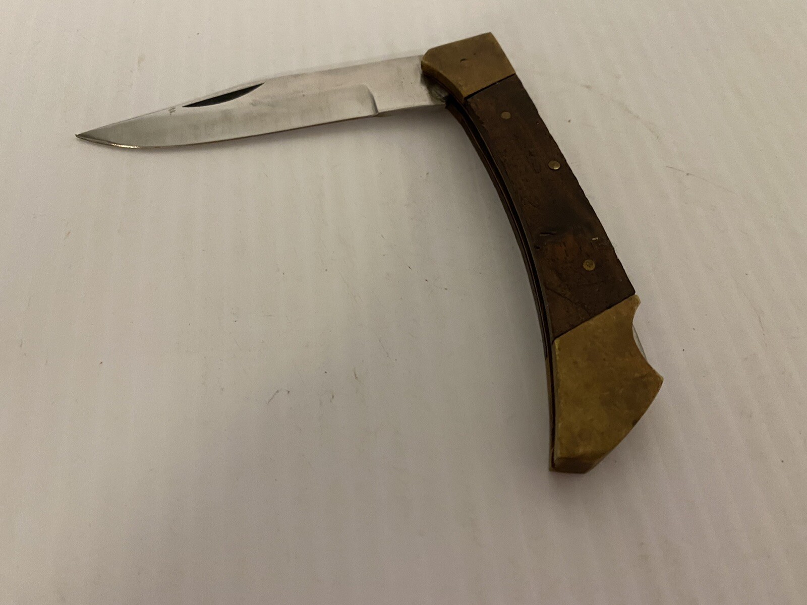 Brass and woodgrain small pocket knife