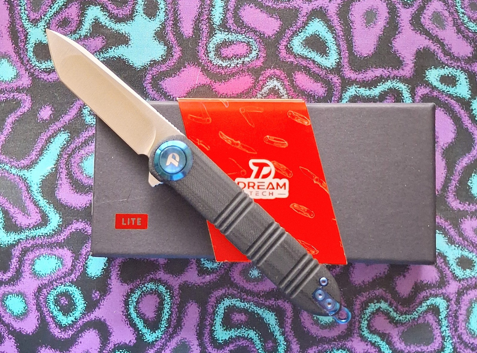 Dreamtech K4324GB Pivot Button Lock Black G10 Blue Accents 14C28N Pocket Knife