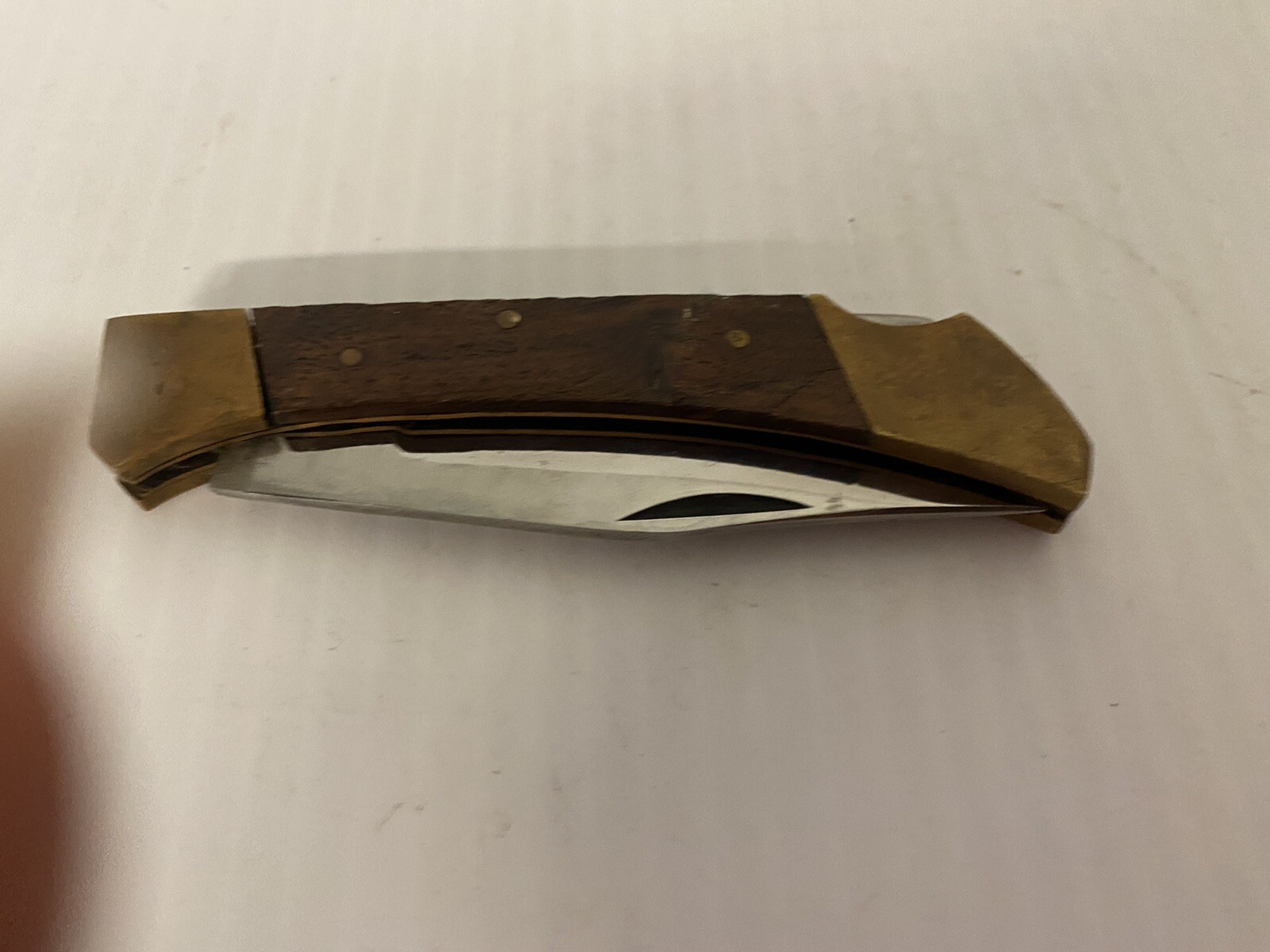 Brass and woodgrain small pocket knife