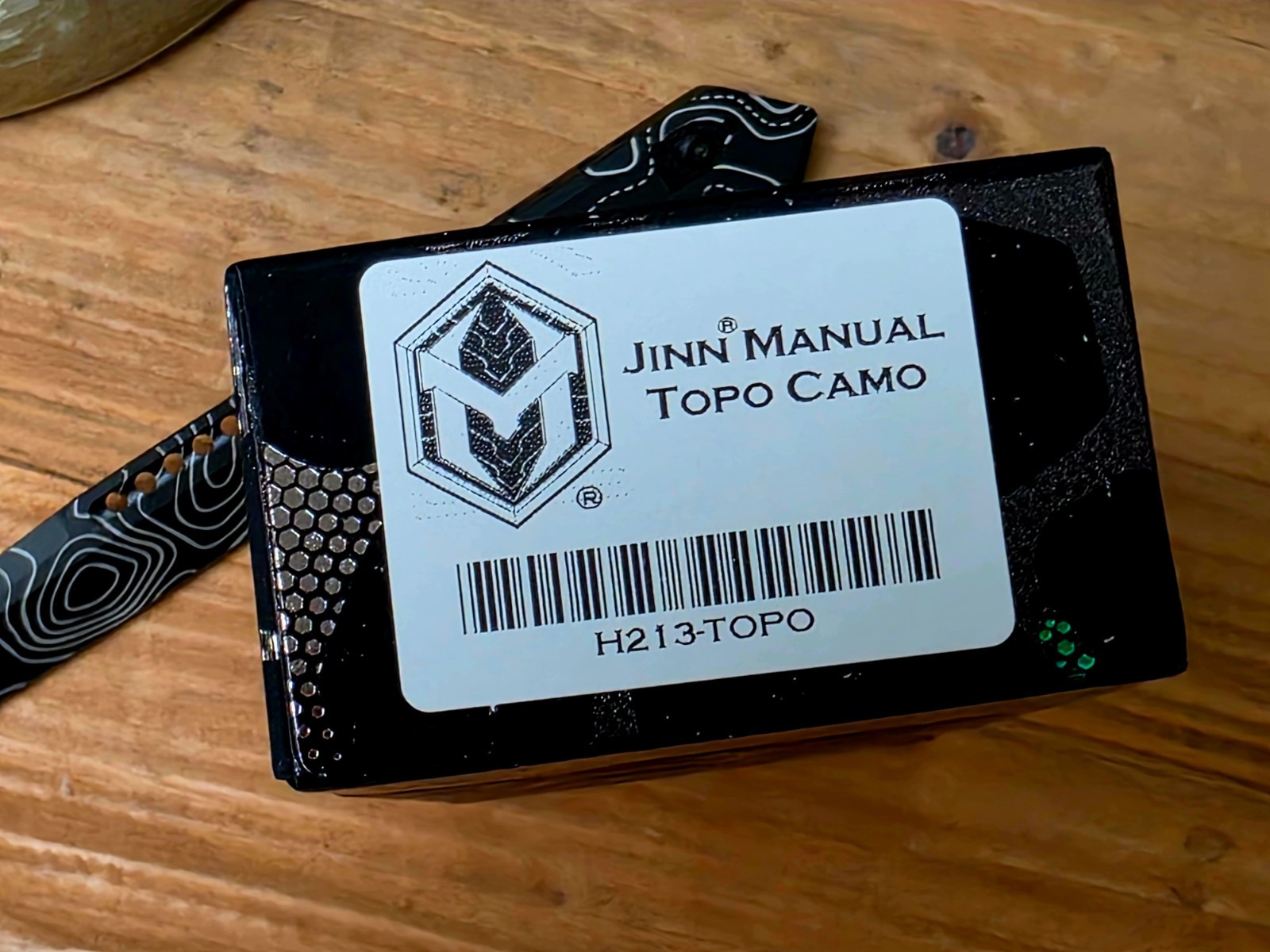 Heretic Knives Jinn Button‑Lock Flipper Black/White Topo MagnaCut DLC H213-TOPO