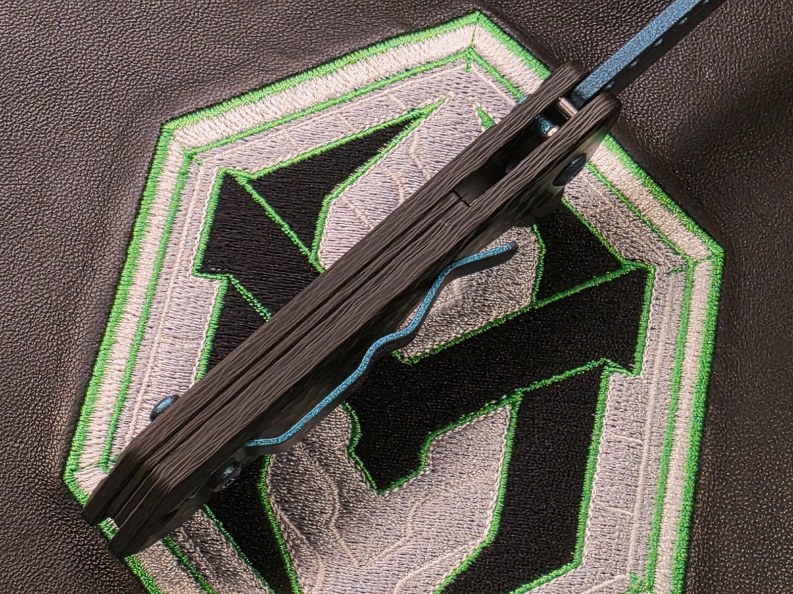 Heretic Jinn Button Lock Flipper Metallic Teal MagnaCut Carbon Fiber Handles