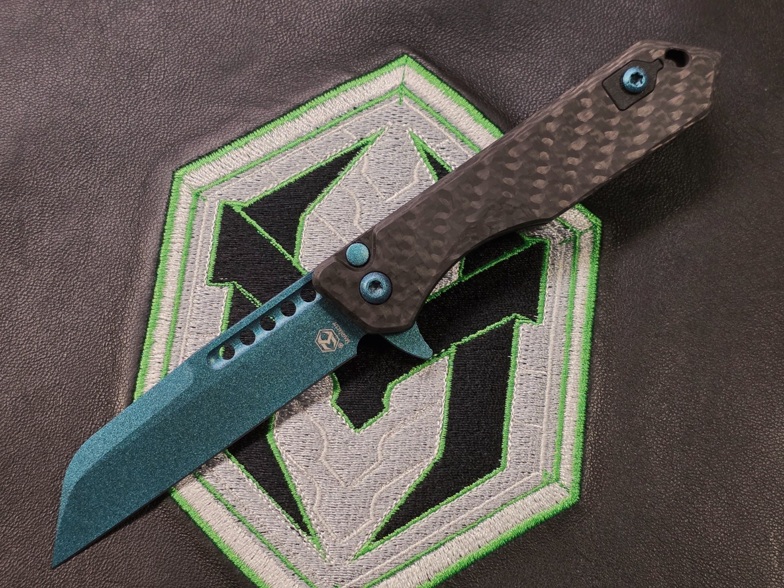 Heretic Jinn Button Lock Flipper Metallic Teal MagnaCut Carbon Fiber Handles